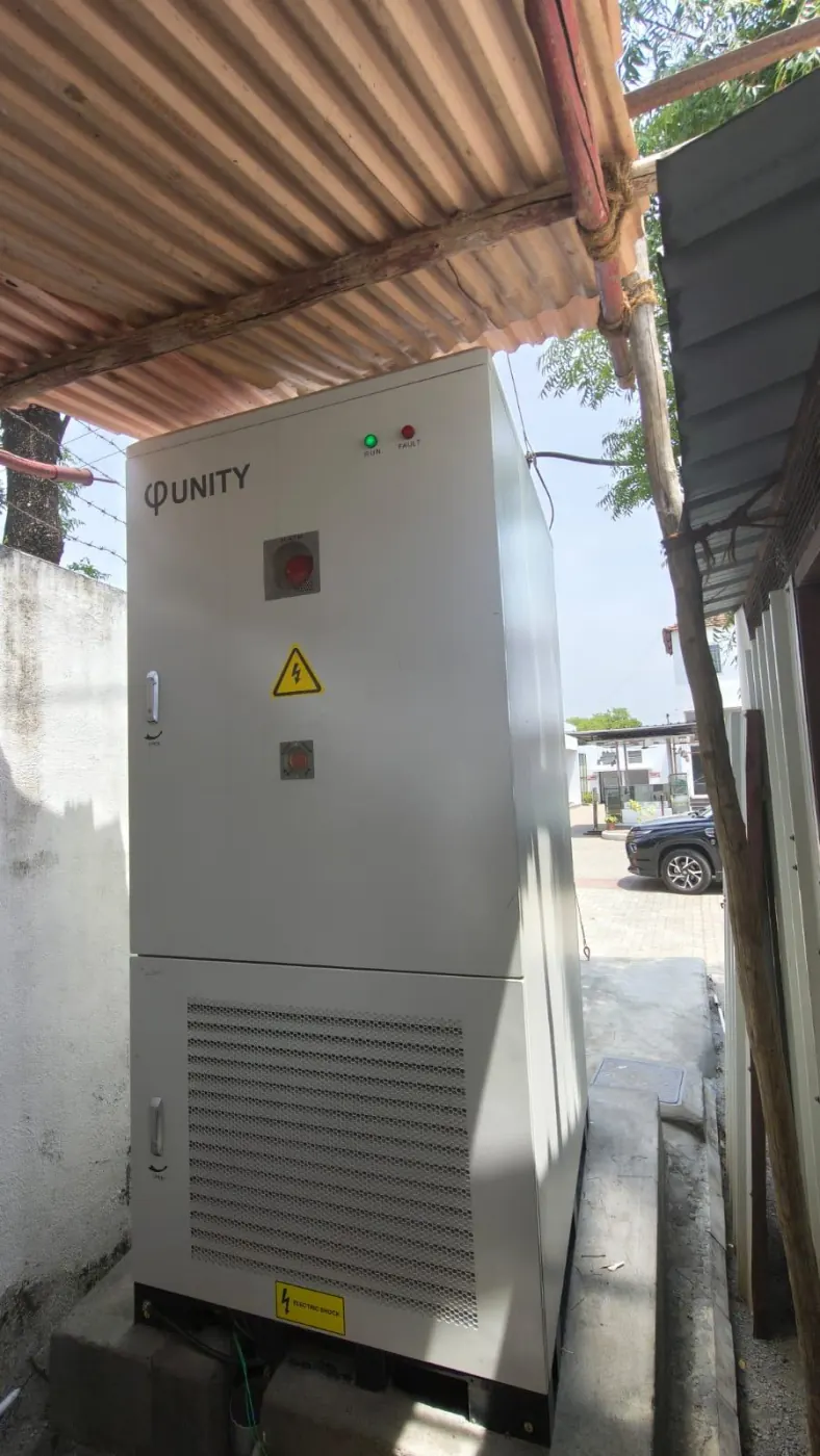 UnityESS battery cabinet under a shed at the 261 kWh EV charging site in Coimbatore, Tamil Nadu