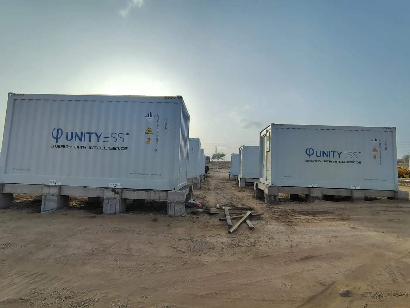 UnityESS battery containers on concrete piers at a 35 MWh site in Phalodi, Rajasthan